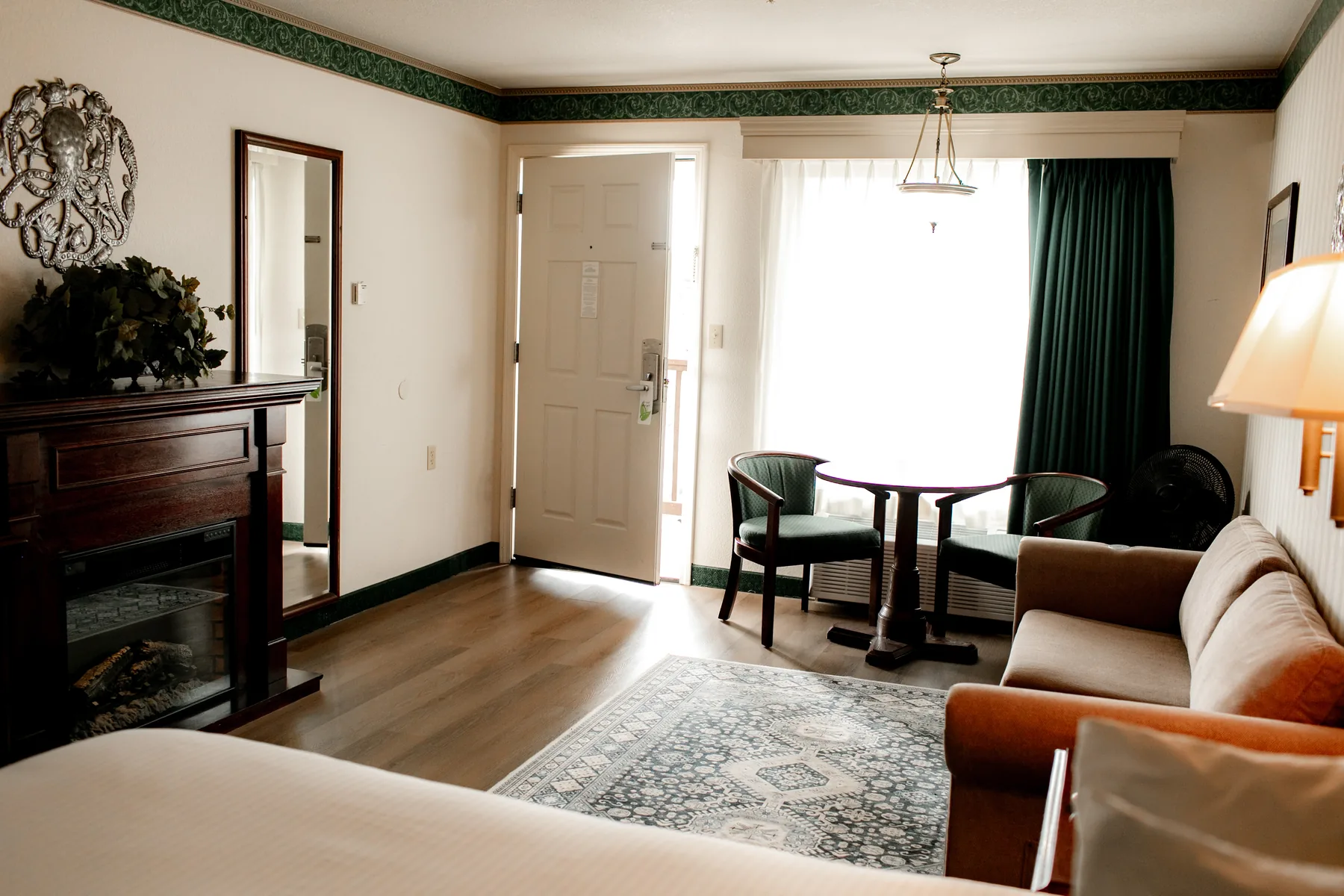 Suite sitting area with front door and chairs