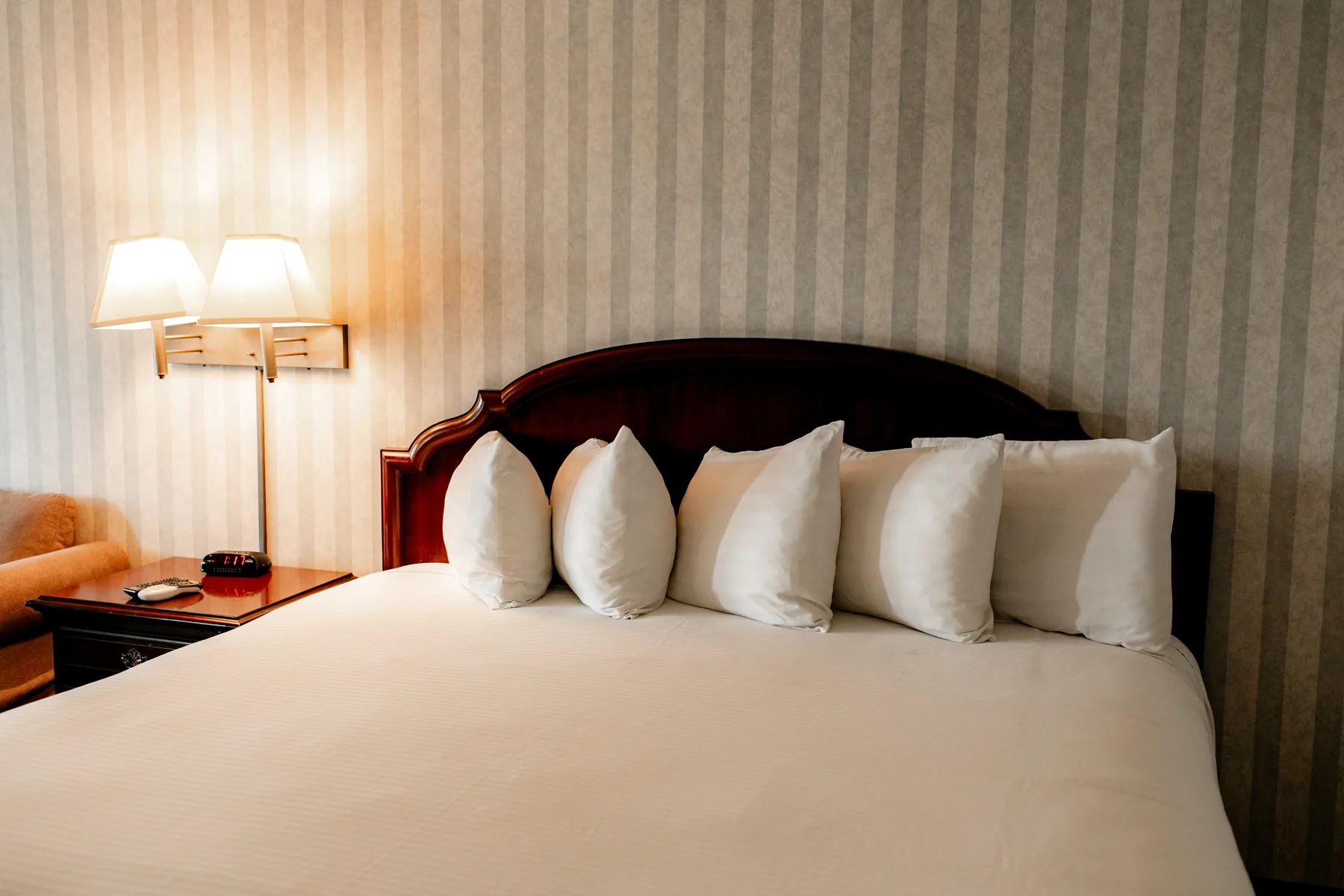 King bed with wall sconces