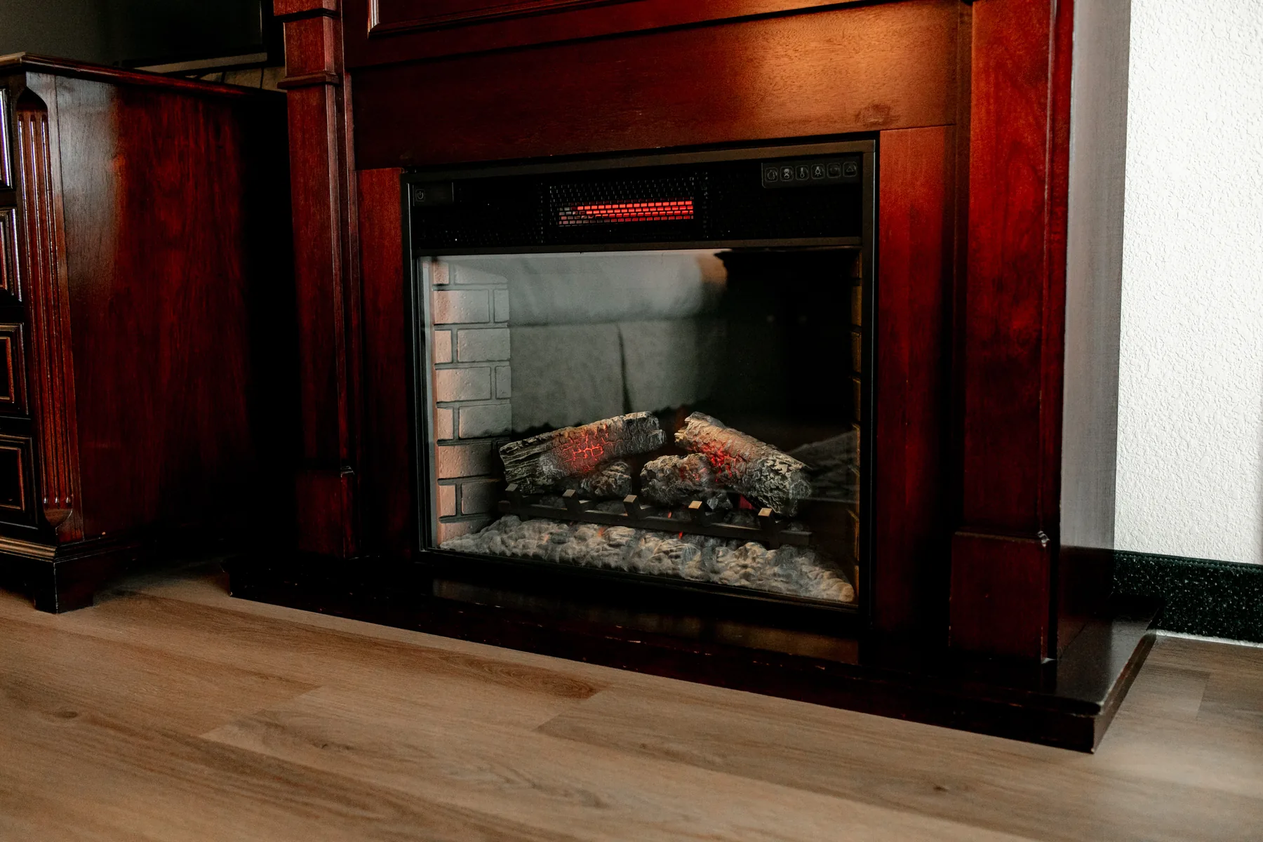 Electric fireplace with wood surround