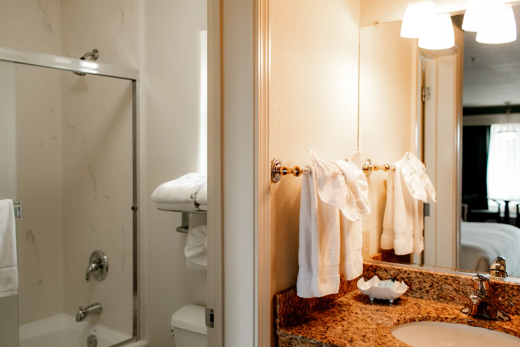 Granite vanity with towels and mirror