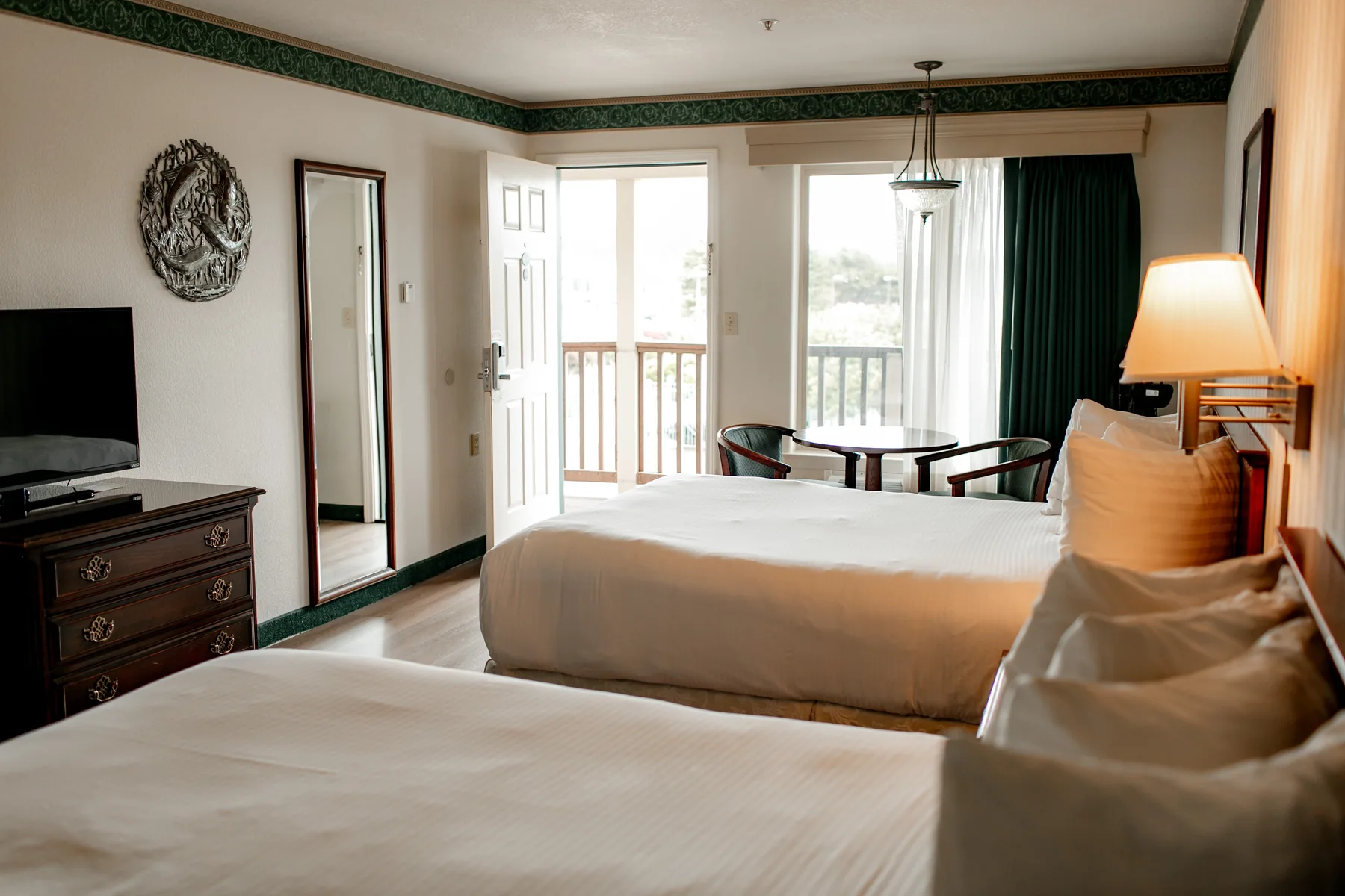 Two queen room with sitting table by the balcony