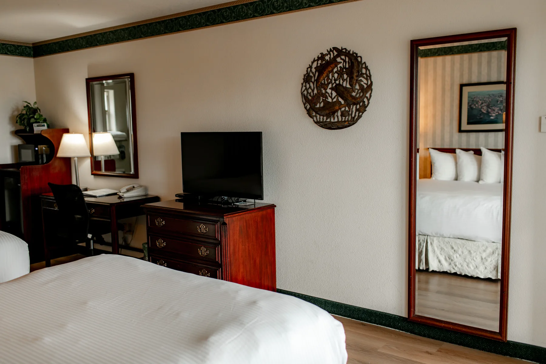 Two queen room television and mirror wall