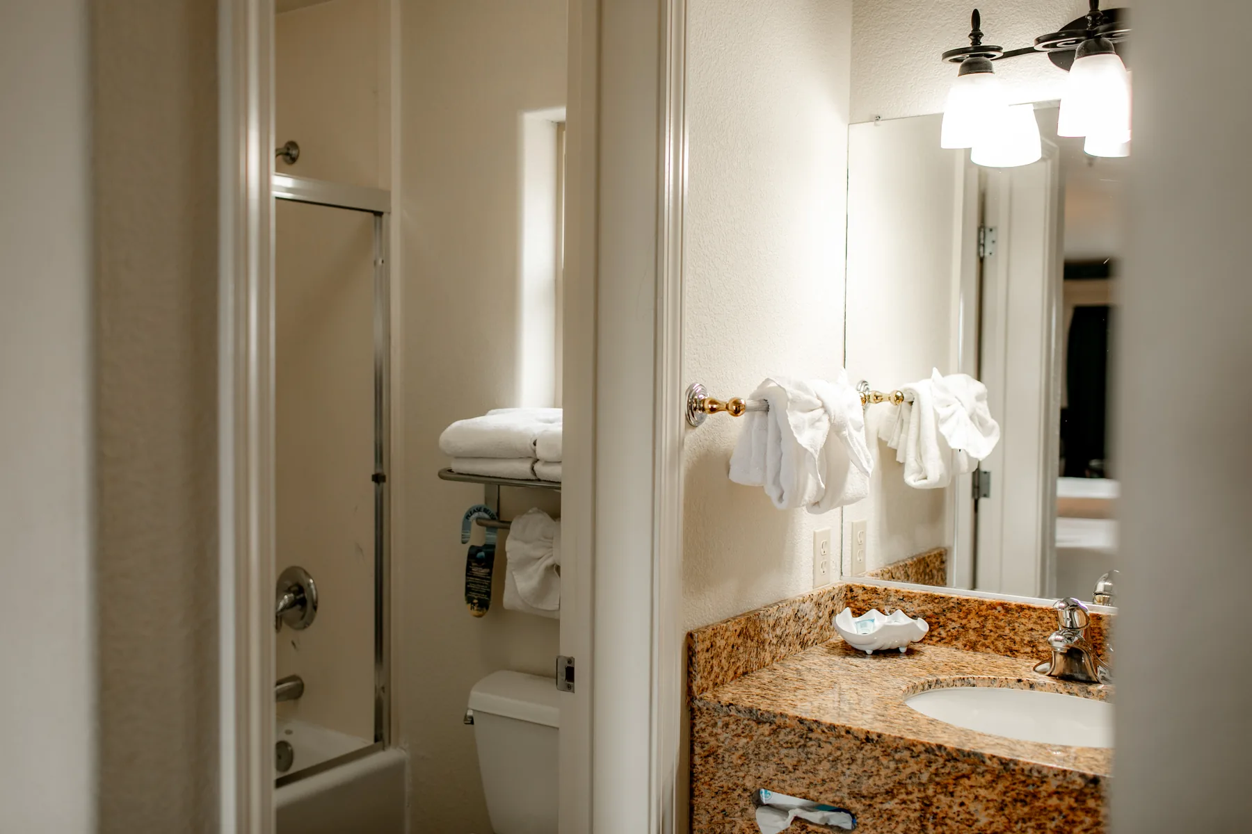 Two queen room bathroom entry and vanity