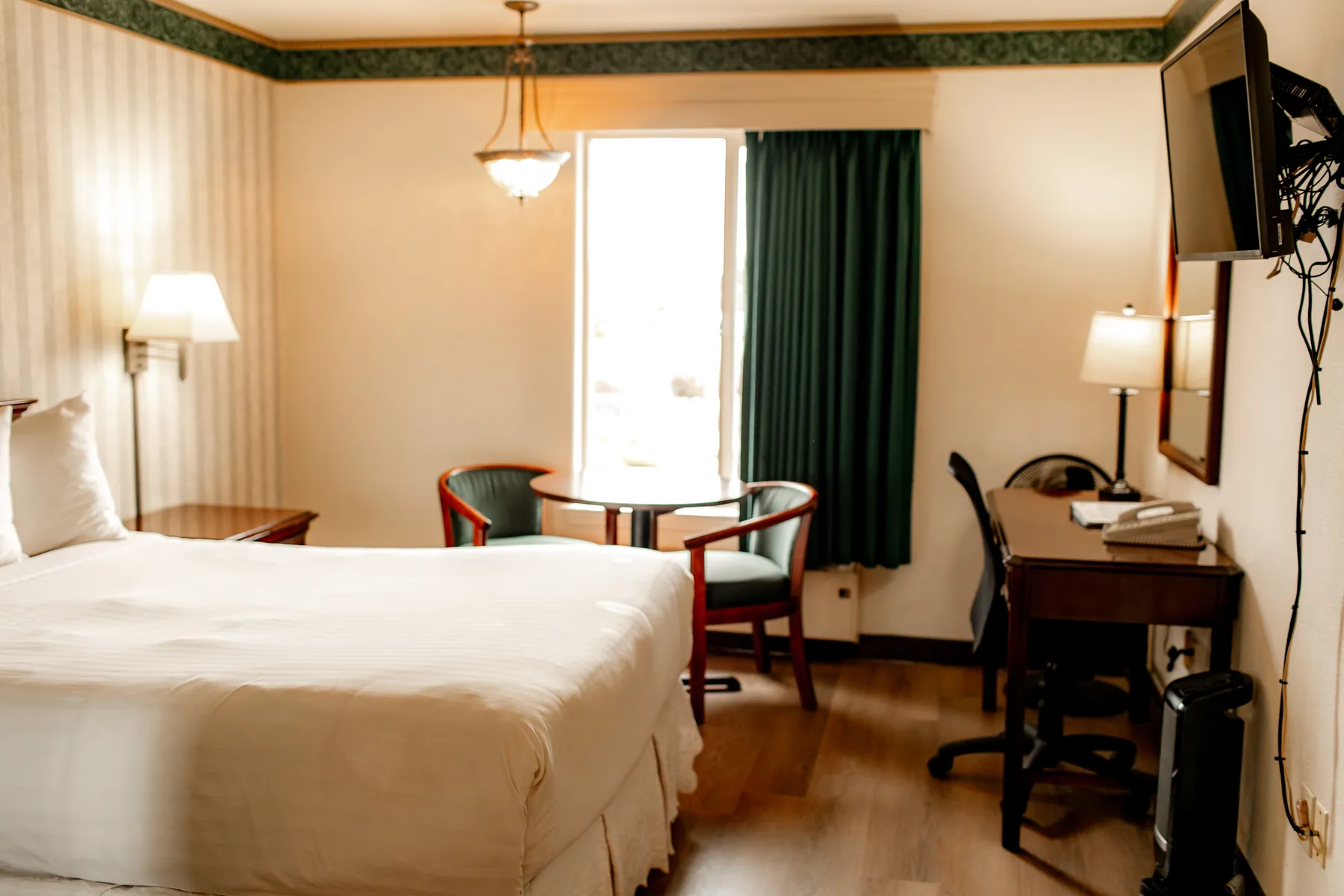 King room with natural light and table seating